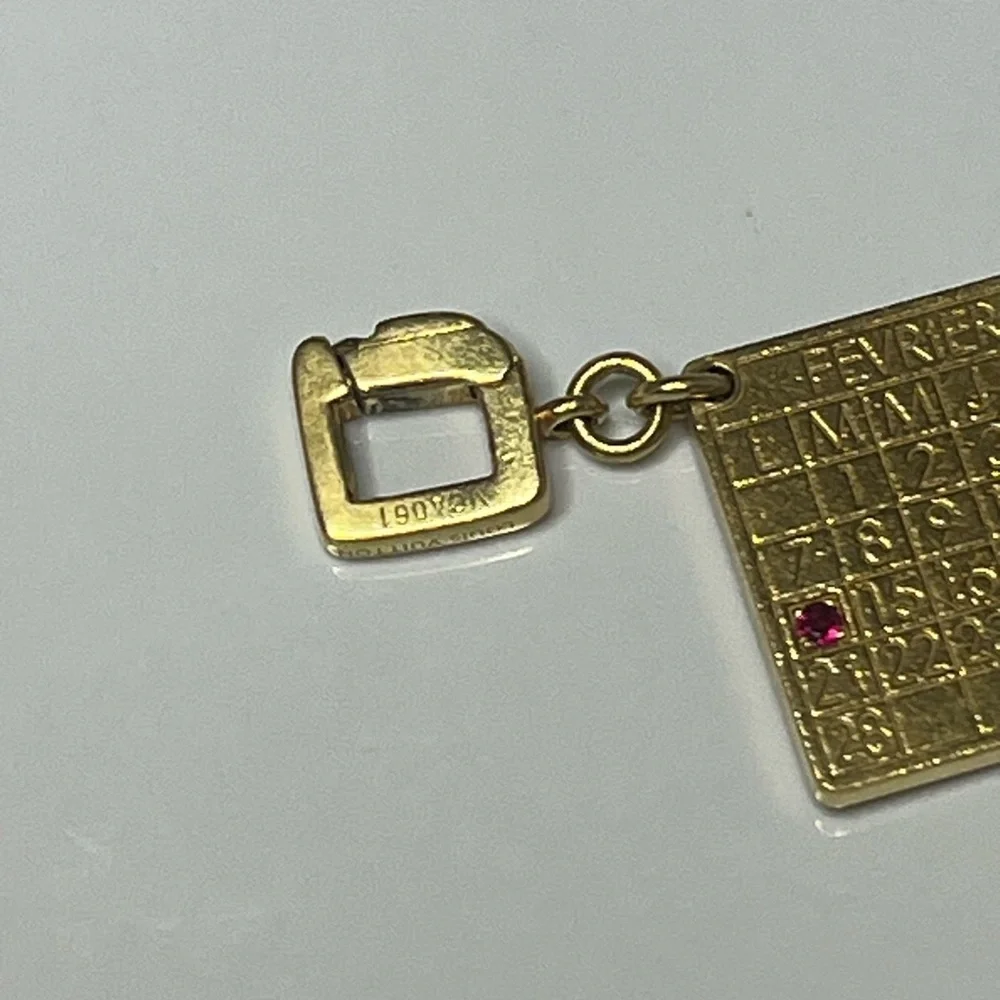 LOUIS VUITTON 18KT GOLD CALENDAR CHARM W/RUBY VINTAGE 2005